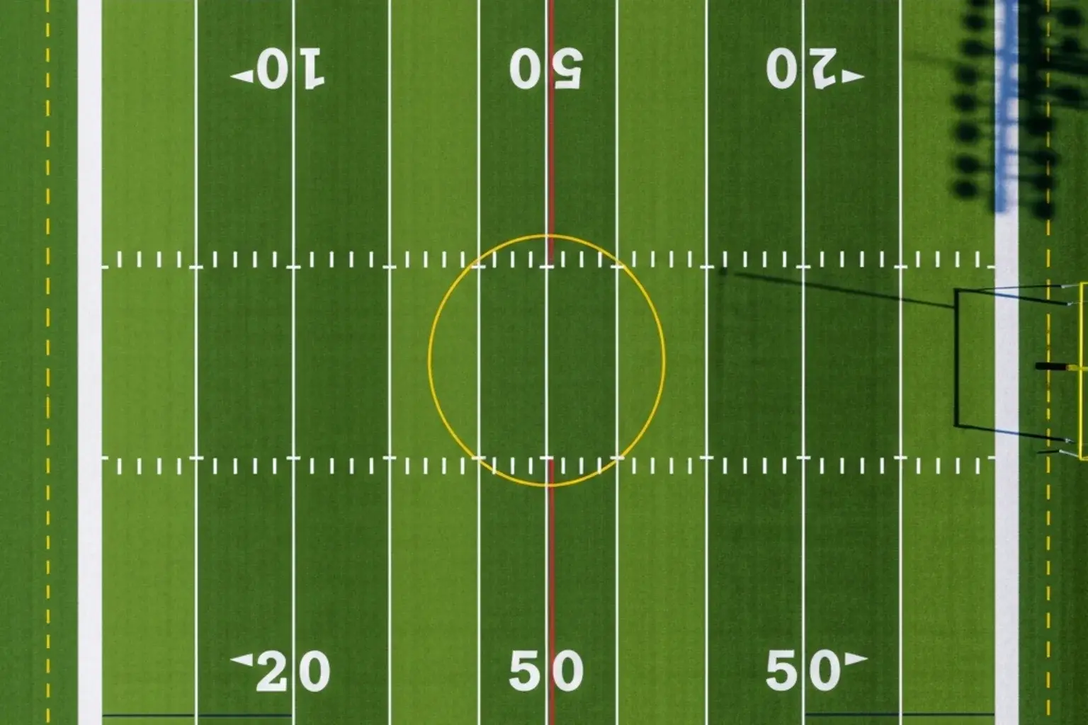 Aerial view of an NFL field showing the red zone area inside the 20-yard line